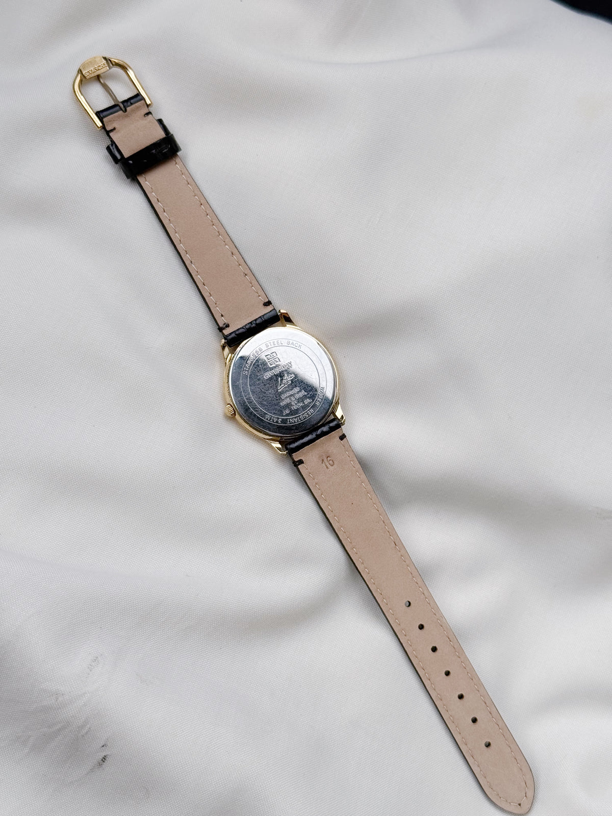 Vintage Givenchy Roman white dial & Leather strap watch; Swiss timepiece