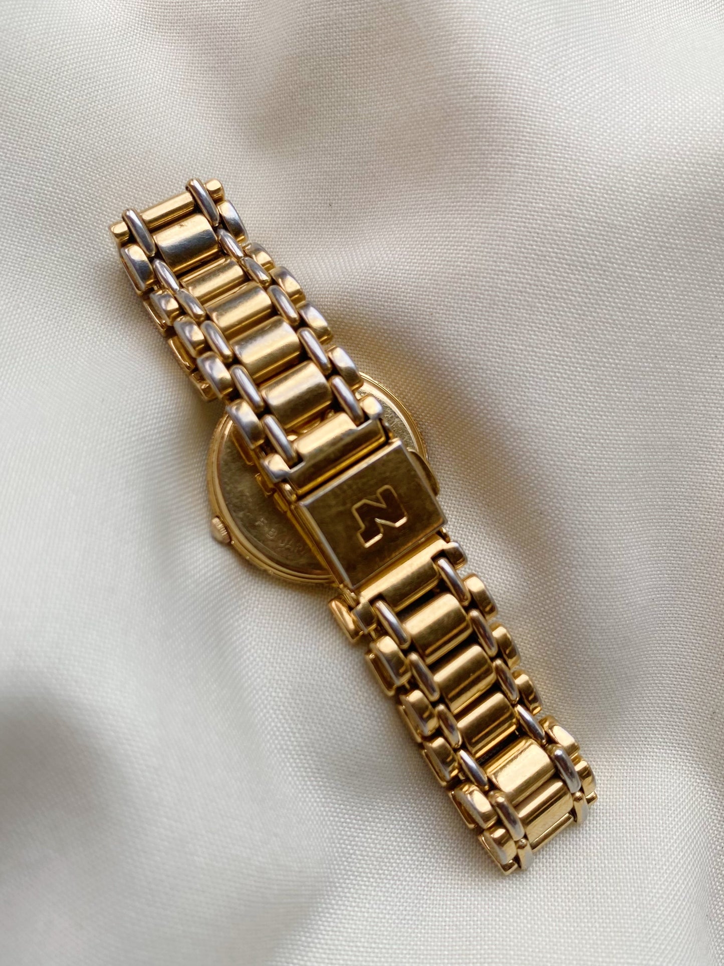 Nina Ricci Gold Tone Watch