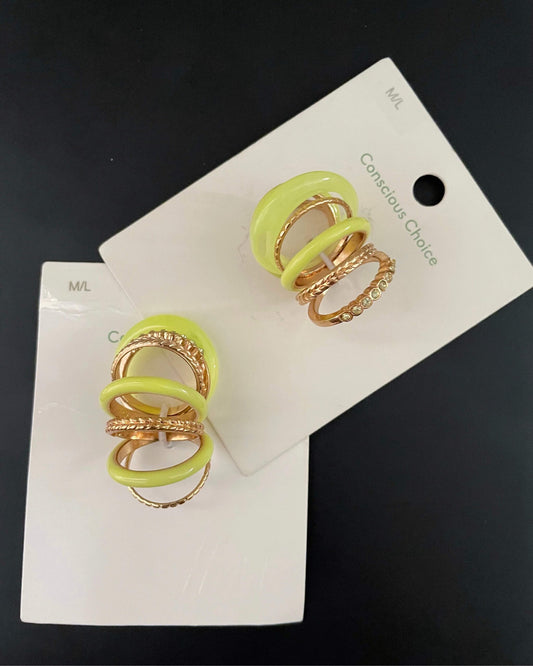 Green themed gold rings