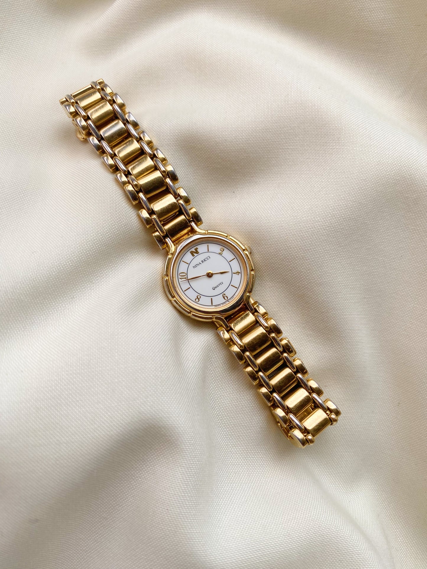 Nina Ricci Gold Tone Watch