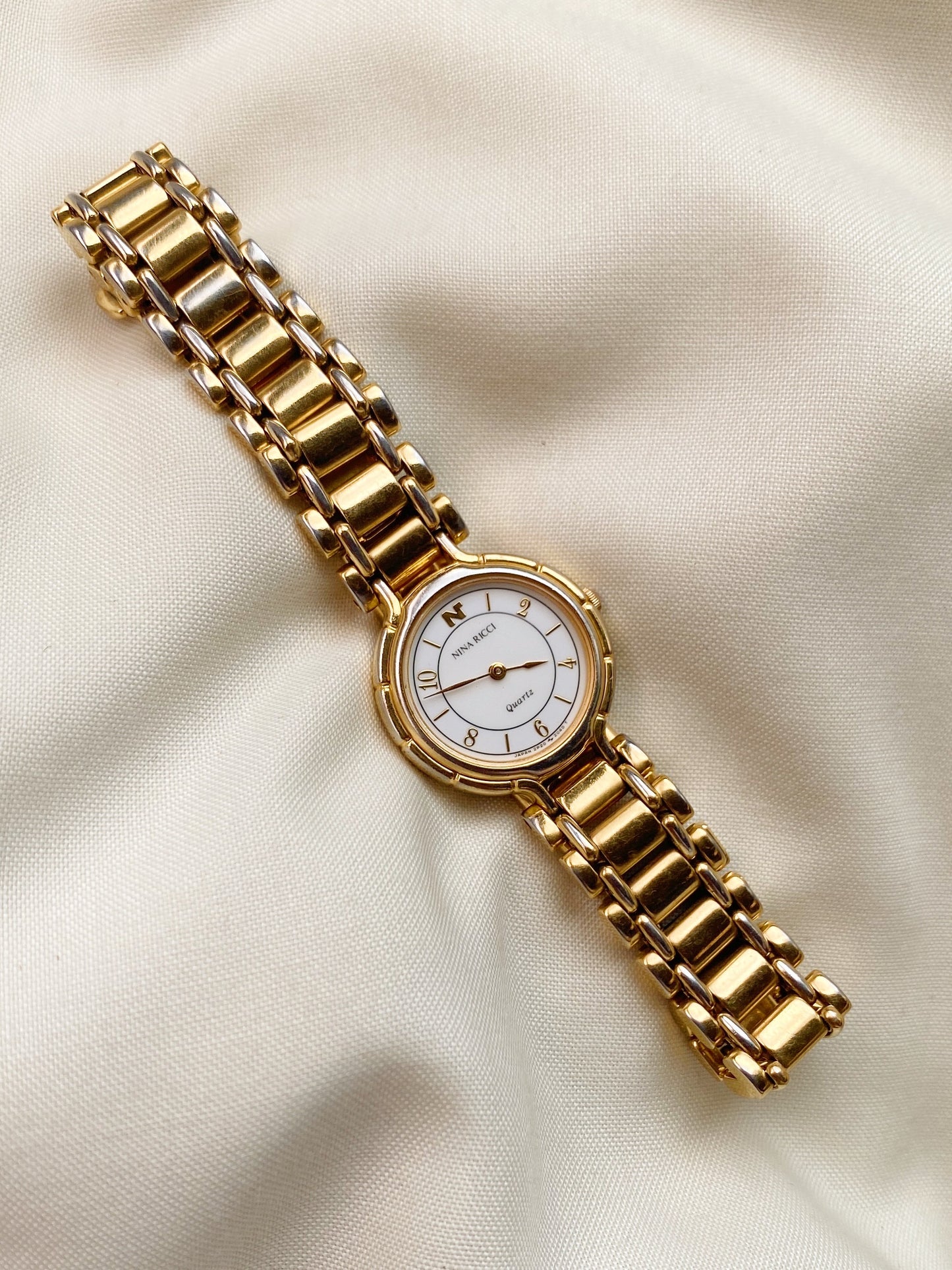 Nina Ricci Gold Tone Watch