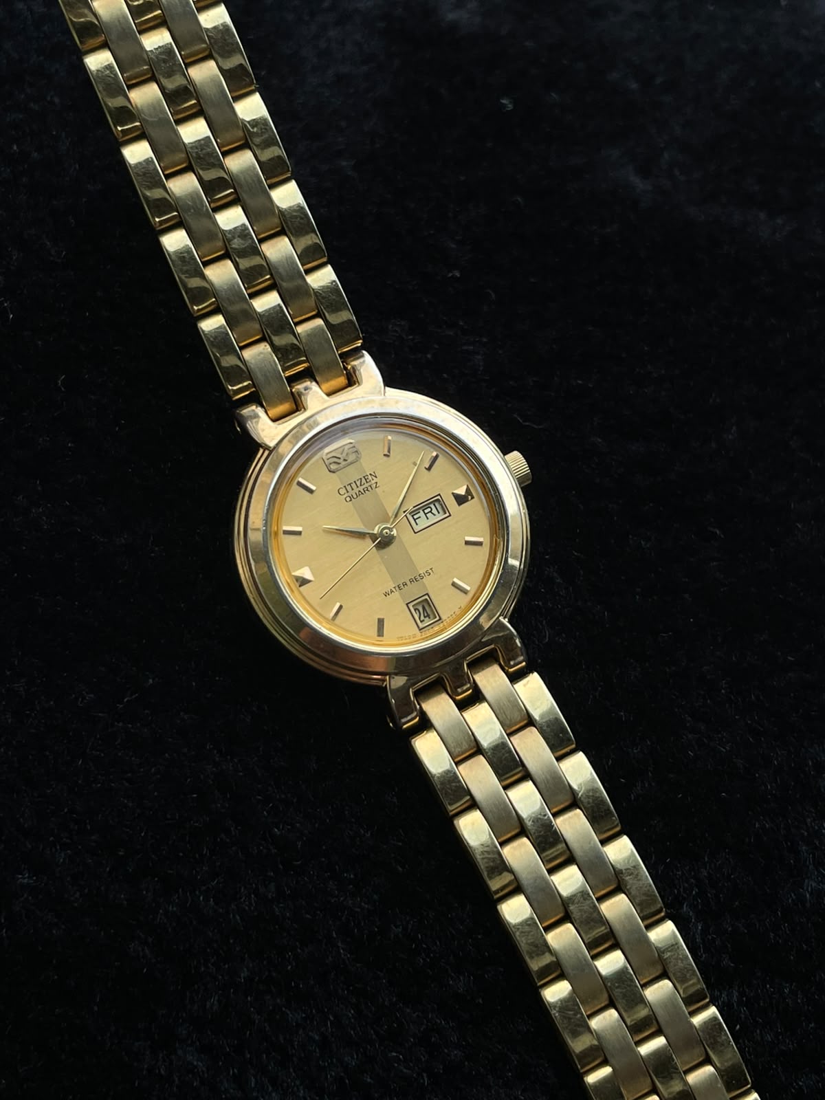 Vintage Citizen gold-tone watch with a day-date display women’s quartz watch